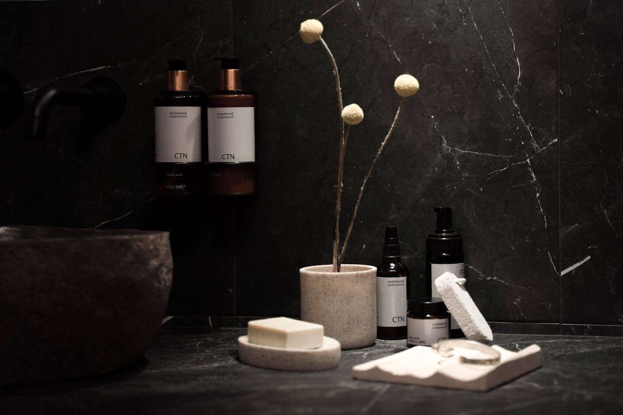 Crafting Captivating Headlines: Your awesome post title goes here A minimalist spa scene with elegant skincare products, soap bars, and delicate decor on a dark marble countertop.